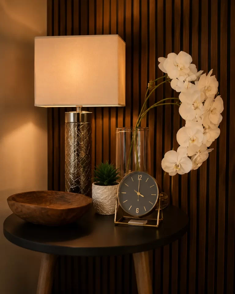 A lamp, clock, and orchids in a quiet corner of the counseling office