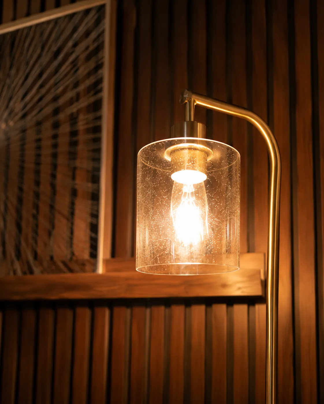 Warm lamp beside the wood-slat wall in the Clearwater office