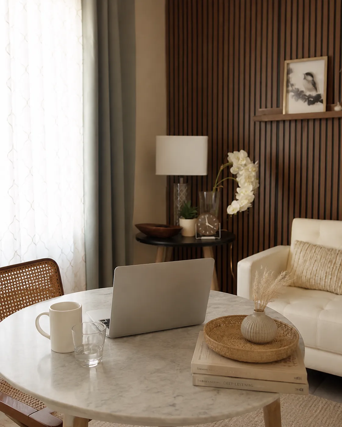 Desk with a laptop ready for a virtual therapy session